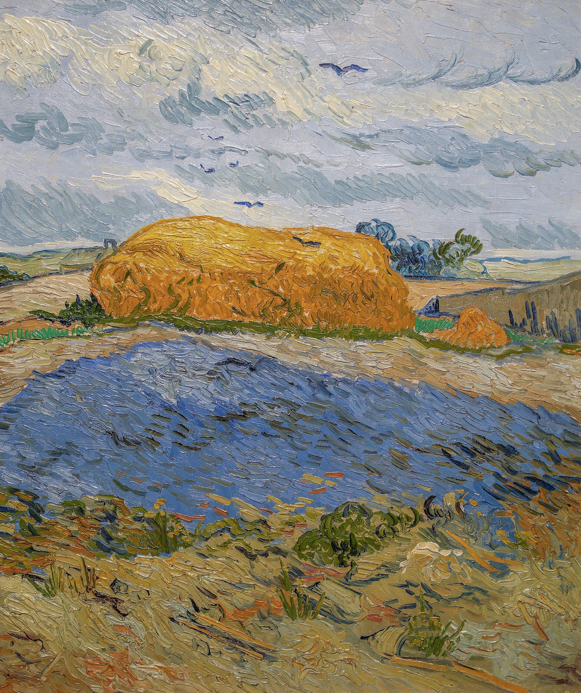 Høstakke under en regnfuld himmel - Vincent van Gogh