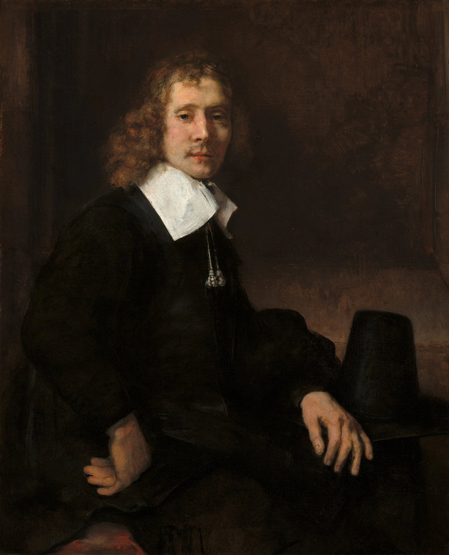 En ung mand siddende ved et bord (måske Govaert Flinck) - Rembrandt