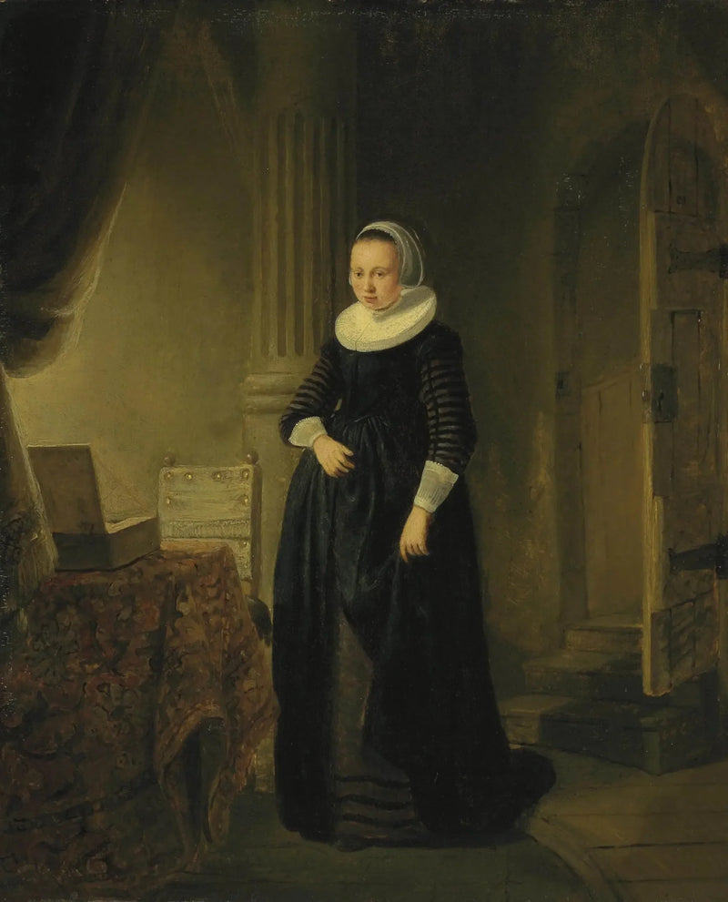 Portræt af en kvinde, stående i fuld figur i et interiør - Rembrandt