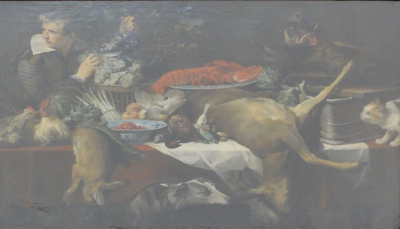 Scène de cuisine avec du gibier et des légumes, un garçon de cuisine tenant une grappe de raisin. - Frans Snyders